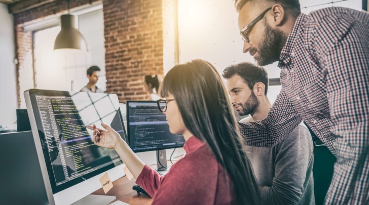 man helping his team implement a 3D kitchen planning solution