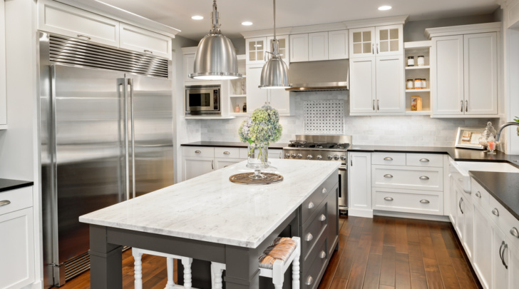 large kitchen with white countertop island and gray countertop