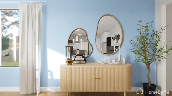 Cool accent wall in trendy dusty blue paint and wood furniture